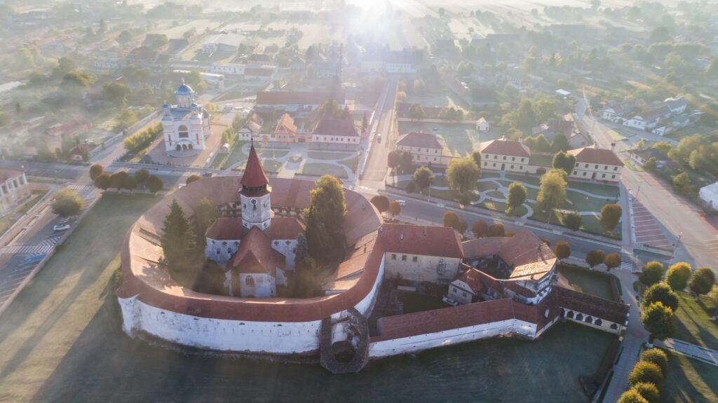 10 Enchanting Destinations You Must Discover in Romania 2 Aerial view of Prejmer fortified Church. Brasov, Romania