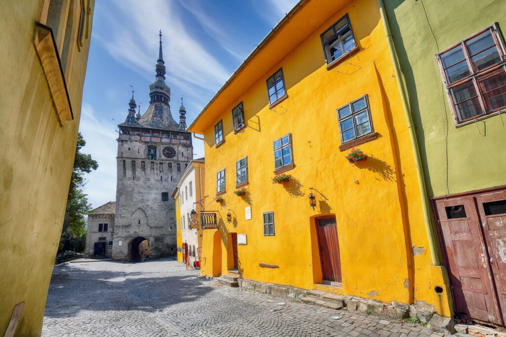 15 Extraordinary Destinations You Can’t Miss in Romania 3 Amazing morning view of historic town Sighisoara and Clock Tower built by Saxons.