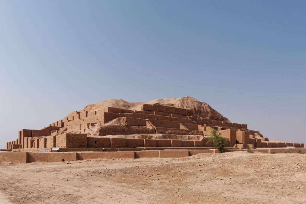Beautiful shot of the historic Ziggurat of Chogha Zanbil under a blue sky in Khuzestan, Iran