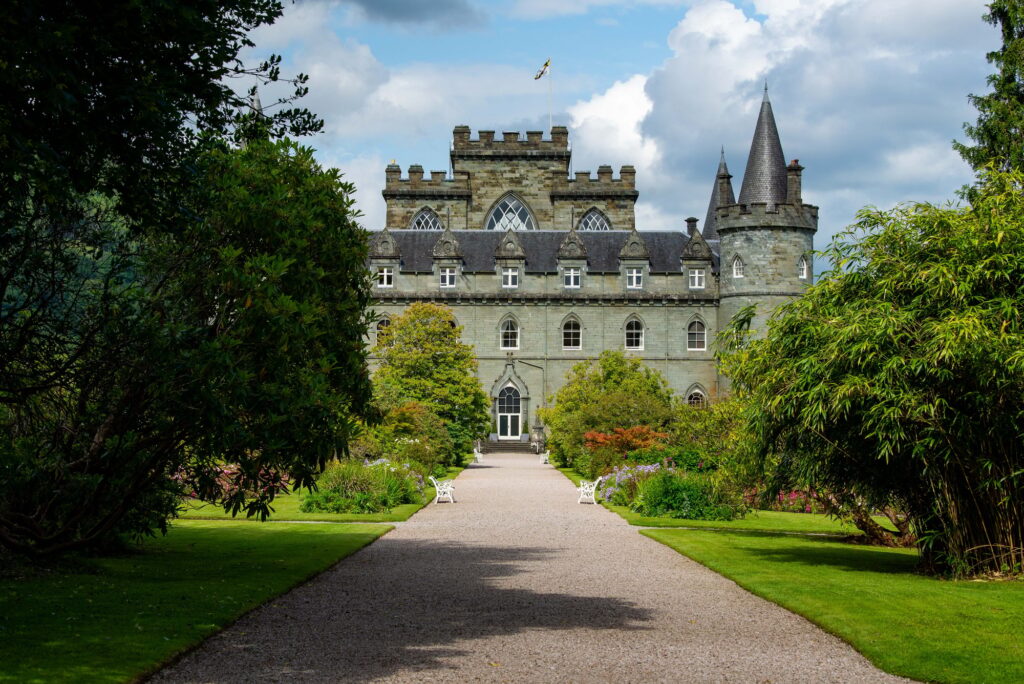 21 Enchanting Castles in Scotland You Must Explore 6 Beautiful way to Inveraray castle surrounded by green trees and bushes