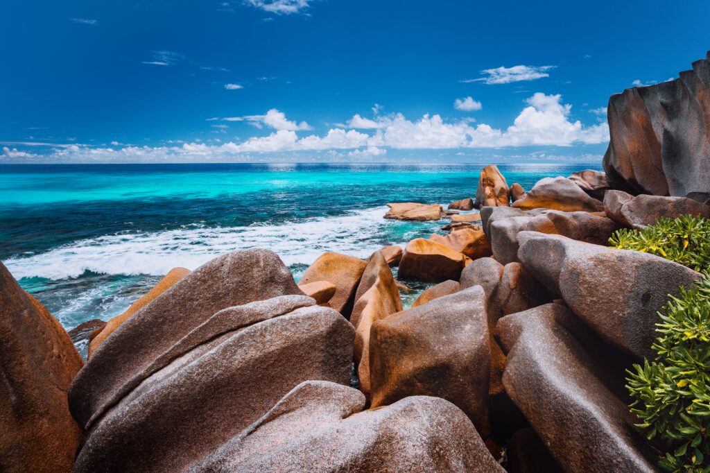 Beautifully shaped granite boulders on Grand Anse beach, La Digue island, Seychelles