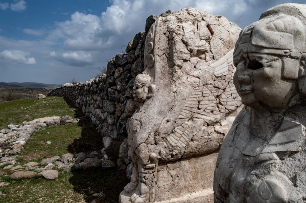12 Enigmatic Lost Cities That Time Forgot 9 Closeup of stone sculptures at the Sphinx Gate of a historical site in Hattusa, Turkey