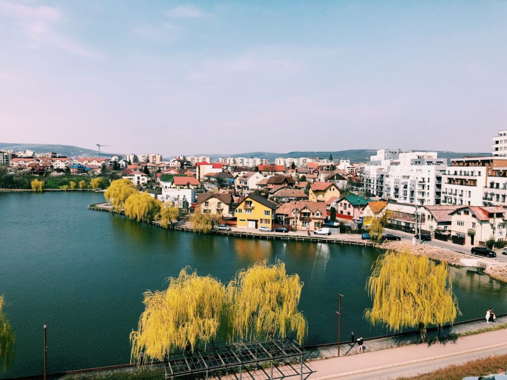 10 Enchanting Destinations You Must Discover in Romania 5 Cluj-Napoca cityscape view of lake an houses