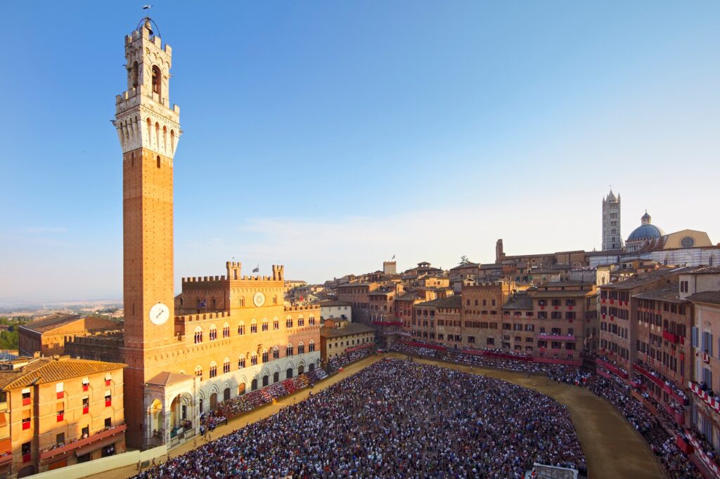 12 Extraordinary City Squares You Can't Miss Around the World 11 Council of Siena, Piazza del Campo during horse race of Palio, Siena,Tuscany, Italy