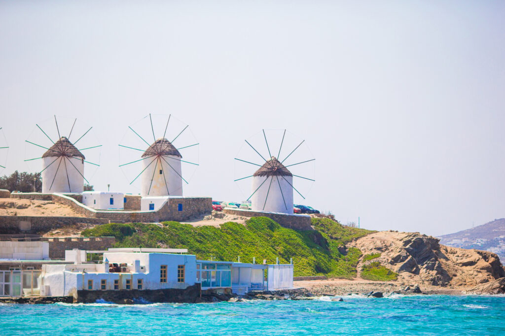 6 Enchanting Old Windmills You Have to See 3 Famous view of traditional greek windmills on Mykonos island at sunrise, Cyclades, Greece