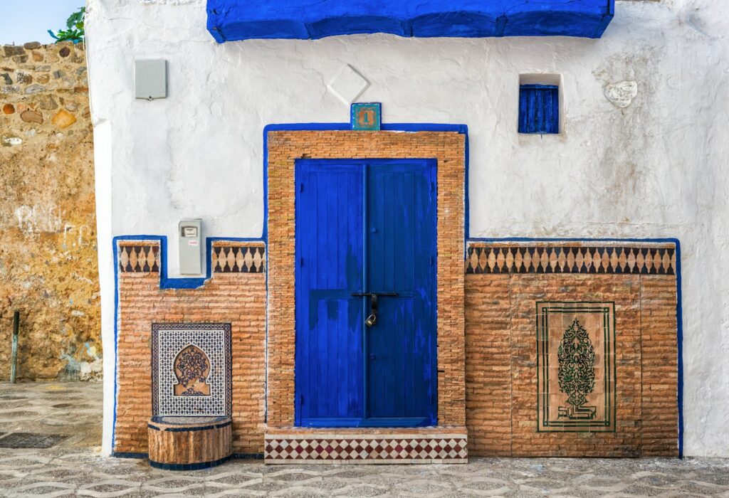 17 Enchanting Destinations in Morocco That You Must Experience 12 a blue and white building with a blue door