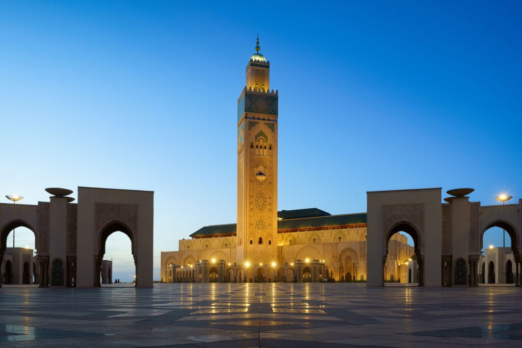 17 Enchanting Destinations in Morocco That You Must Experience 6 Illuminated Hassan II Mosque with its reflection on the stoned ground in Casablanca, Morocco