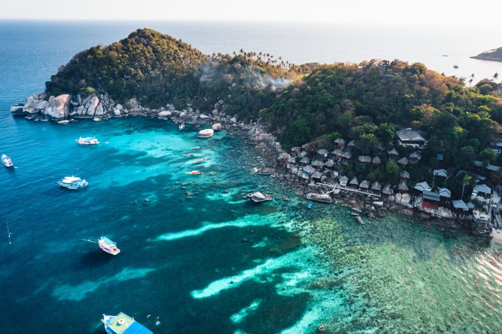 17 Extraordinary Places You Can’t Miss in Thailand 5 Island and boat in clear sea at Koh Tao