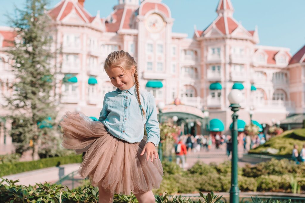 8 Enchanting Honeymoon Destinations to Ignite Your Love 9 Little adorable girl in Cinderella dress at fairy-tale Disneyland park