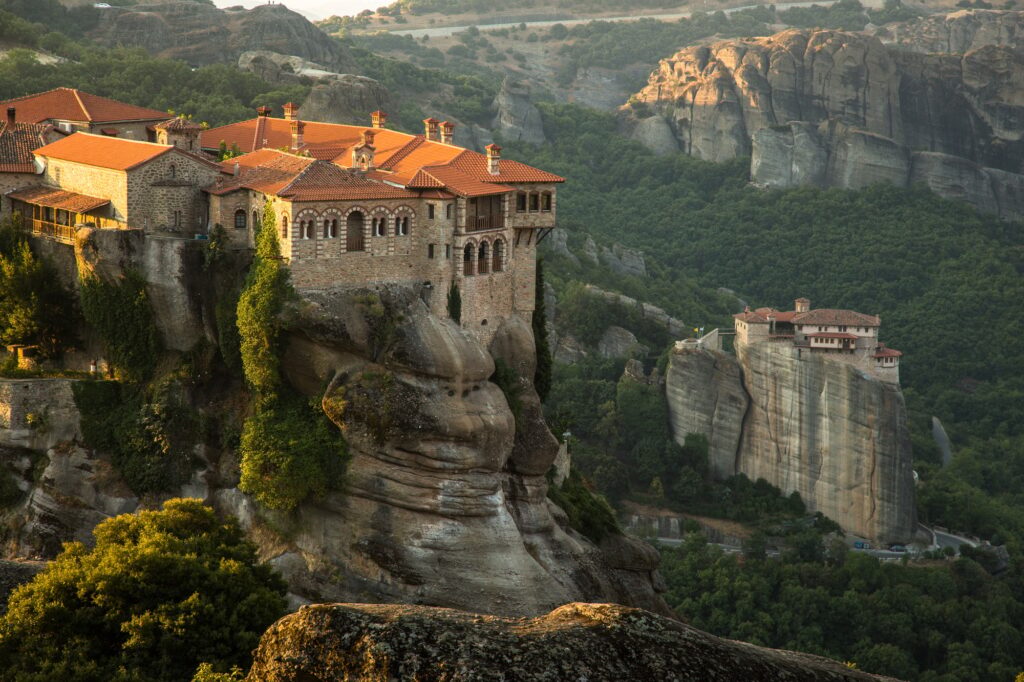 10 Extraordinary Monasteries You Must Explore 8 Meteora monasteries View on the Holy Monastery of Varlaam and Roussanou Monastery on background