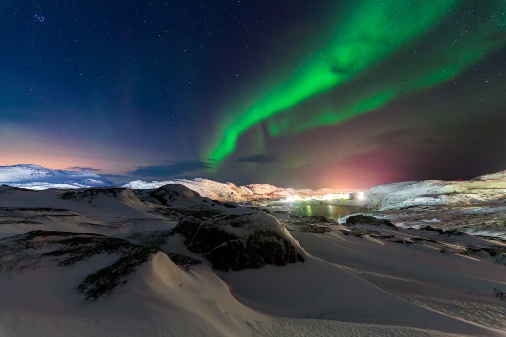 7 Enchanting Reasons to Embark on a Journey to Norway 3 Northern lights above the fjord in Norway