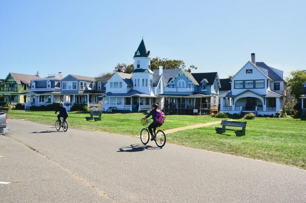 Discover the Top 10 Must-See Destinations in Massachusetts: A Traveler's Dream Guide 6 People riding their bikes in a neighborhood on Martha’s Vineyard.