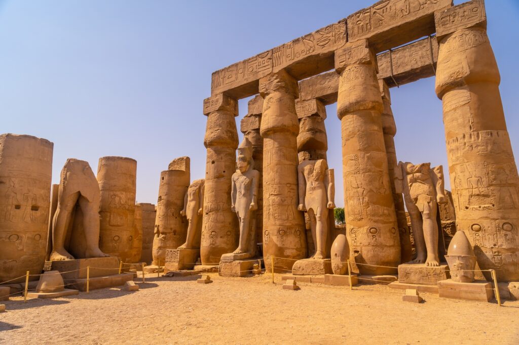 7 Enigmatic Temples of Ancient Egypt That Will Take Your Breath Away 4 Sculptures of pharaohs and ancient Egyptian drawings on the columns of the Luxor Temple