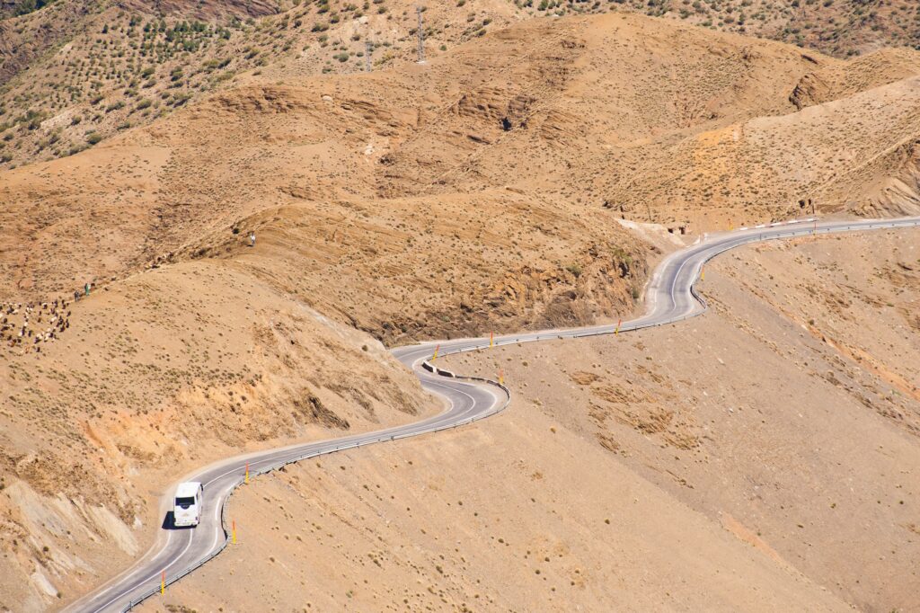 17 Enchanting Destinations in Morocco That You Must Experience 5 Tourist bus driving in the High Atlas Mountains just outside Marrakech on the Tizi n Tichka pass, Mo