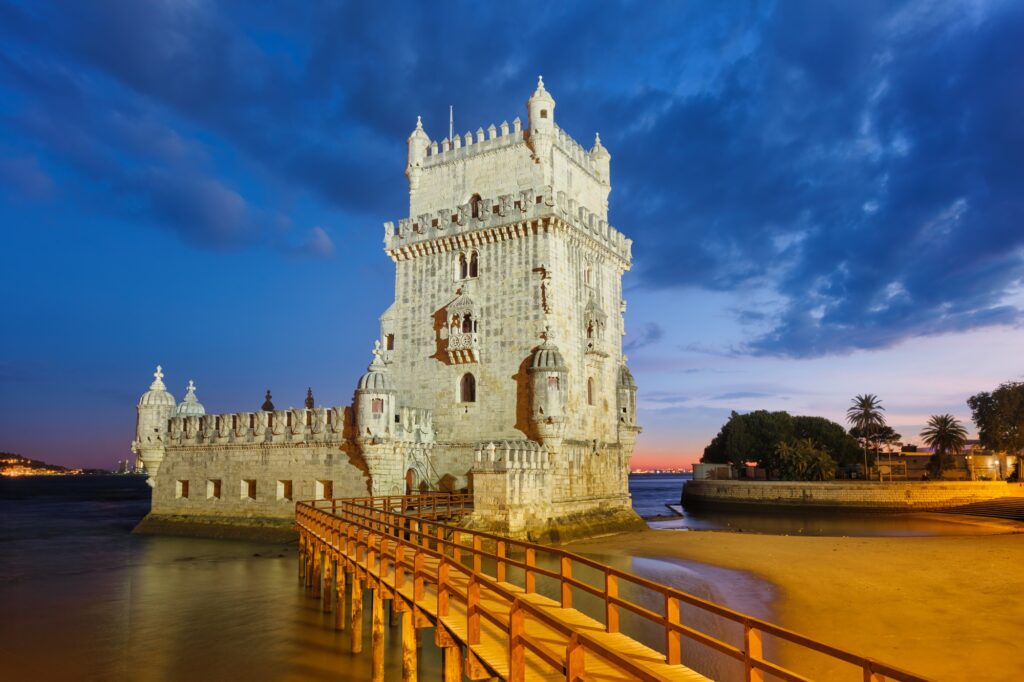 14 Iconic Towers from Around the Globe That Will Take Your Breath Away 10 Belem Tower on the bank of the Tagus River in twilight. Lisbon, Portugal
