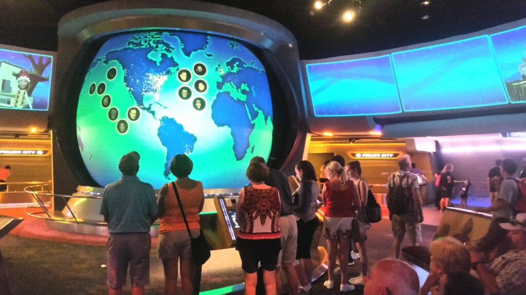 10 Extraordinary Destinations You Can't Miss in Florida 7 Family fun visiting a tourist attraction at Disney world with neon lights and world map of data.