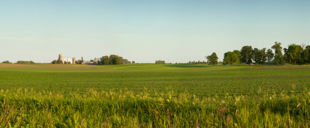 10 Fascinating Flattest States in America to Explore 11 Panorama of a farm and fields on a sunny spring evening in Minnesota