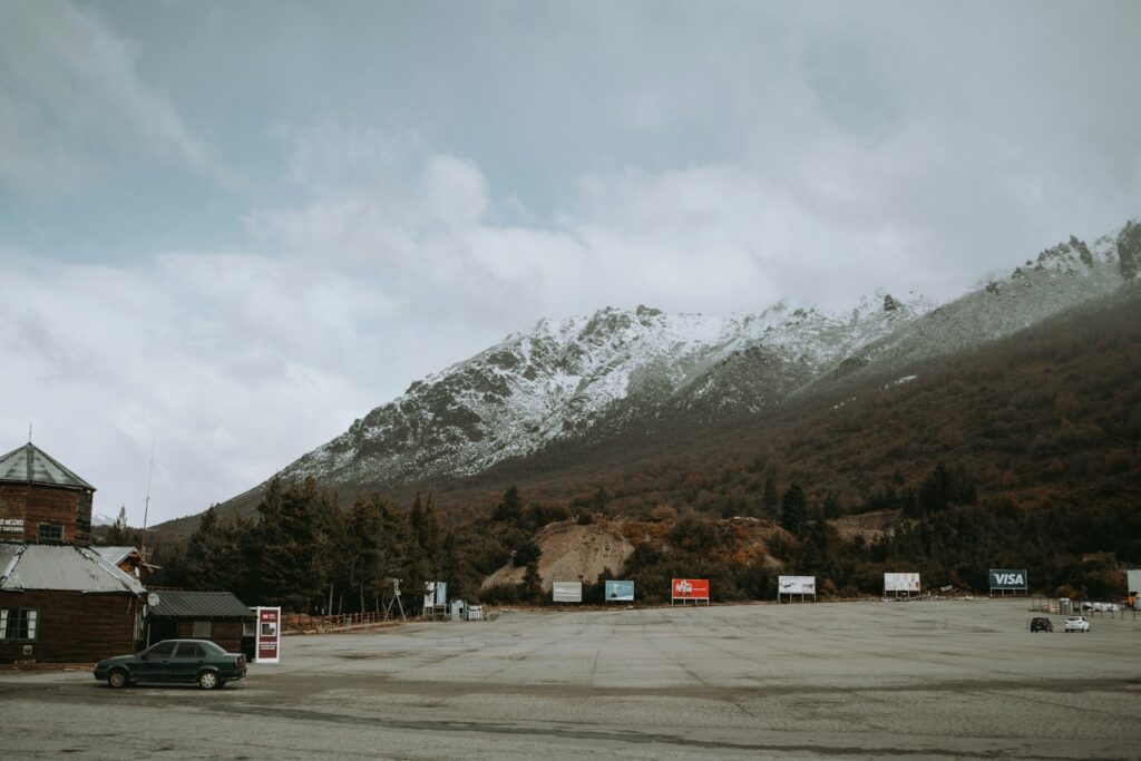 Discovering Argentina: 23 Extraordinary Attractions You Can’t Miss 13 a car parked in a parking lot in front of a mountain