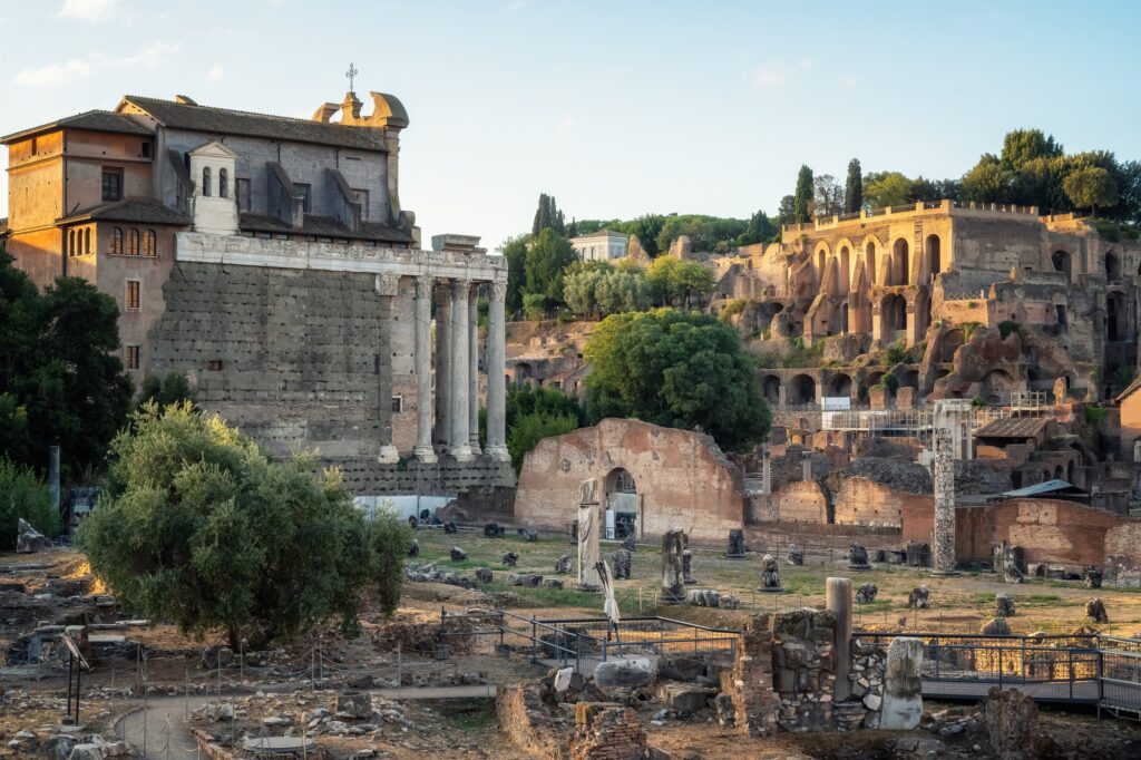 13 Enchanting Attractions in Rome You Must Experience 6 The ruins of the famous Roman Forum illuminated by the first sun rays